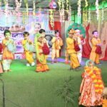 Children dressed as Krishna and Radha performing a traditional dance during Janmashtami