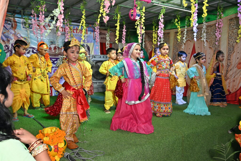 Group of girls dressed as Gopis performing a traditional dance around Krishna on Janmashtami